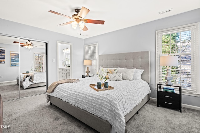 bedroom featuring visible vents, baseboards, a ceiling fan, and carpet floors