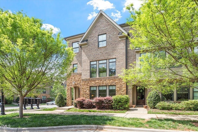 view of front of house with brick siding