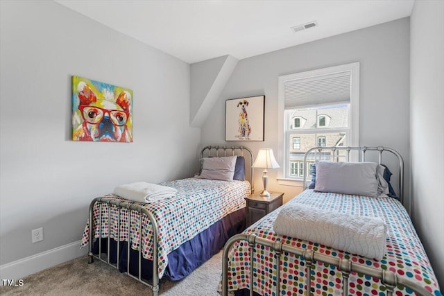 bedroom with visible vents, baseboards, and carpet floors