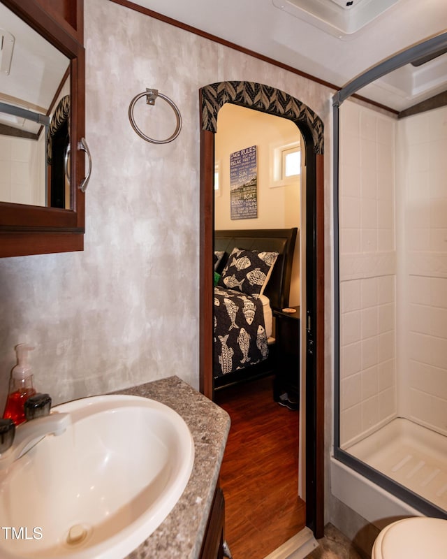 142 Blackhawk Dr, Louisburg, NC 27549 - ensuite bathroom featuring ensuite bath, a stall shower, wood finished floors, and vanity