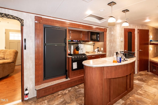 142 Blackhawk Dr, Louisburg, NC 27549 - kitchen with a kitchen island, black appliances, decorative light fixtures, brown cabinetry, and a sink