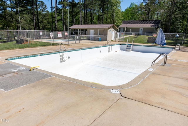 142 Blackhawk Dr, Louisburg, NC 27549 - community pool with a patio area, an outdoor structure, fence, and a lawn