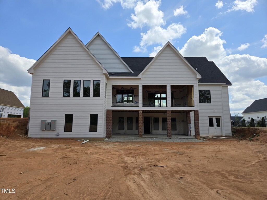 154 Bellini Dr, Clayton, NC 27527 - rear view of house with a patio and a balcony