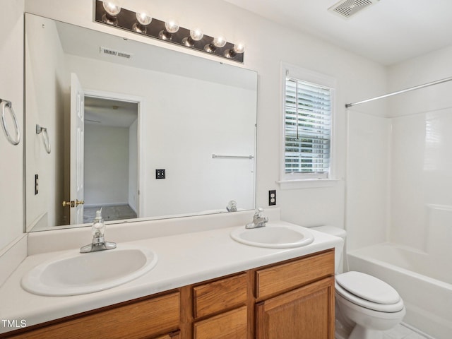 full bathroom featuring toilet, double vanity, and shower / bath combination