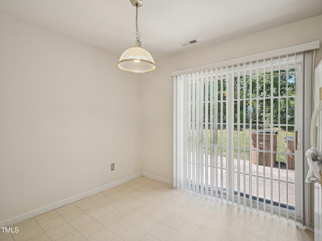 empty room featuring baseboards