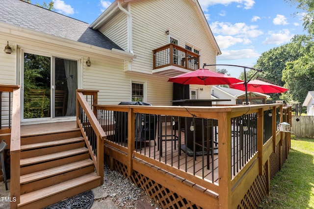 wooden terrace featuring fence