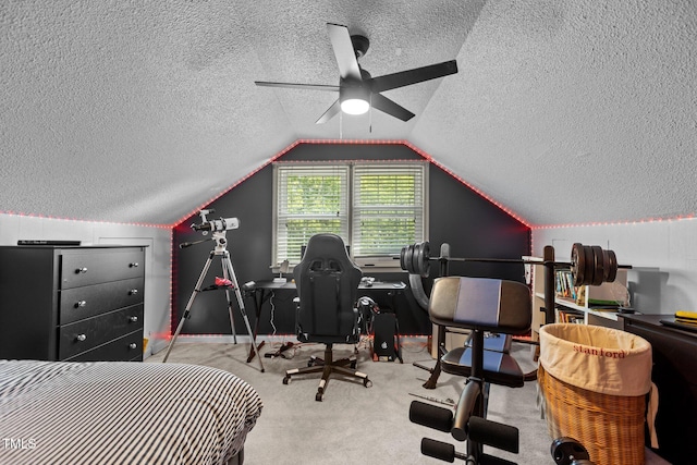 bedroom featuring a textured ceiling, carpet flooring, vaulted ceiling, baseboards, and ceiling fan