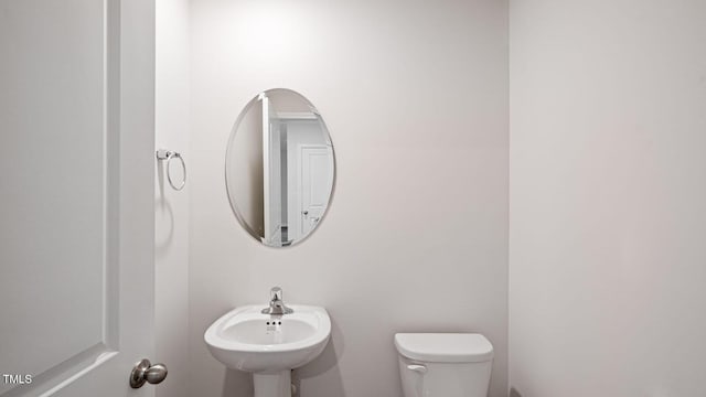 bathroom with a sink and toilet