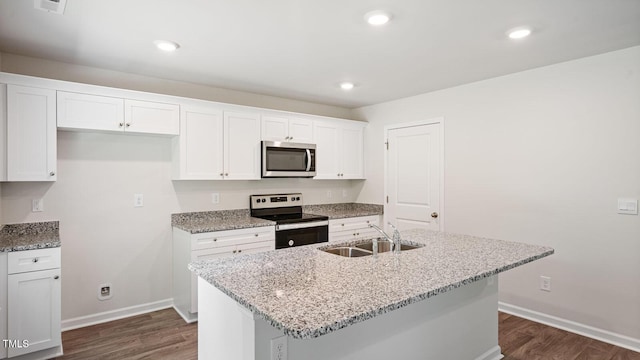 kitchen with dark wood-type flooring, a sink, white cabinetry, and stainless steel appliances
