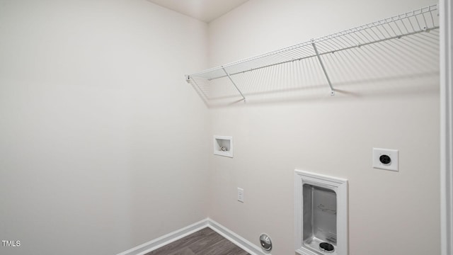 laundry room with laundry area, washer hookup, hookup for an electric dryer, baseboards, and dark wood-style floors