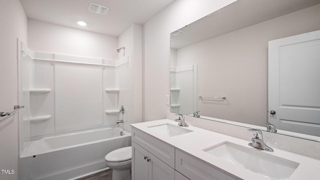 full bathroom featuring a sink, visible vents, toilet, and  shower combination