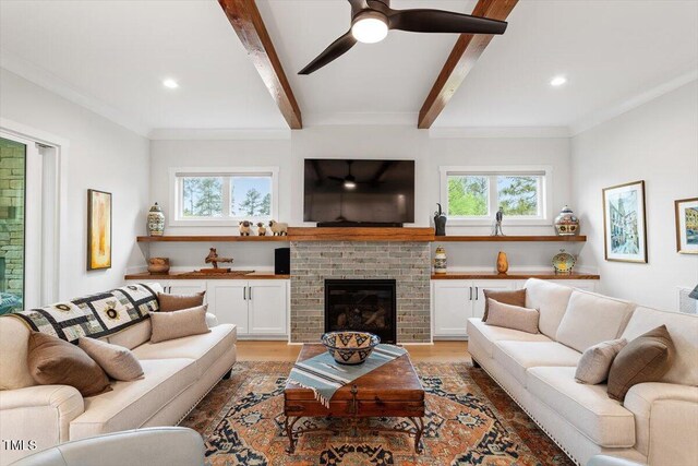 749 Golfers Vw, Pittsboro, NC 27312 - living area featuring beam ceiling, ceiling fan, light wood-style floors, and a healthy amount of sunlight