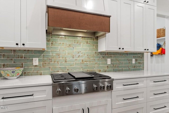 749 Golfers Vw, Pittsboro, NC 27312 - kitchen featuring white cabinets, stainless steel gas cooktop, custom exhaust hood, light countertops, and backsplash