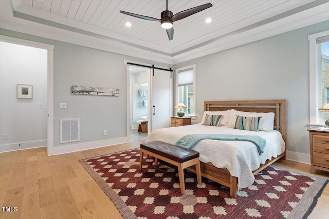 749 Golfers Vw, Pittsboro, NC 27312 - bedroom with visible vents, baseboards, wooden ceiling, a barn door, and light wood-type flooring