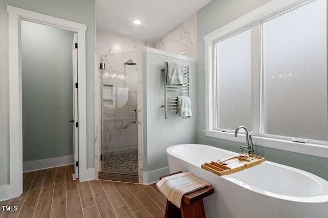 749 Golfers Vw, Pittsboro, NC 27312 - full bath with baseboards, a freestanding bath, a stall shower, and wood tiled floor