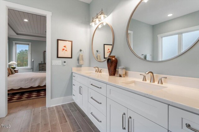 749 Golfers Vw, Pittsboro, NC 27312 - ensuite bathroom featuring baseboards, a sink, wood finish floors, and recessed lighting