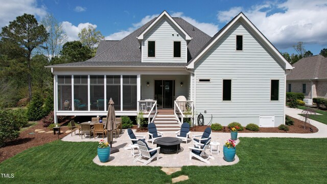 749 Golfers Vw, Pittsboro, NC 27312 - back of house featuring a sunroom, a patio, a fire pit, and a lawn