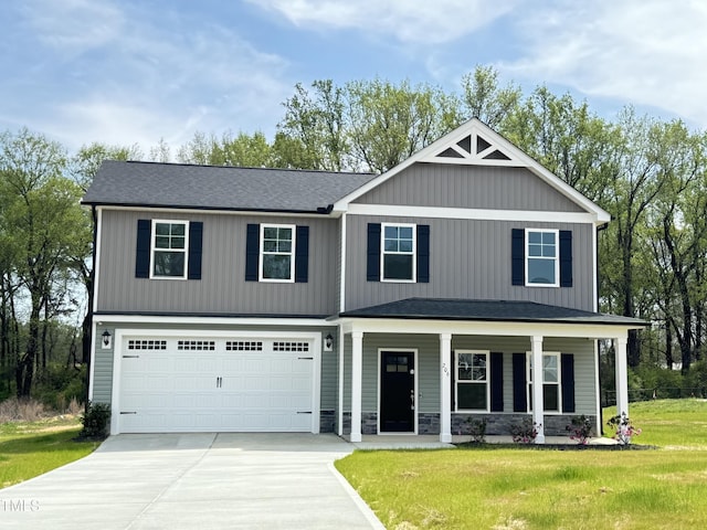 1387 Stoney Creek Church Rd, Goldsboro, NC 27534 - craftsman inspired home with covered porch, a garage, stone siding, concrete driveway, and a front yard
