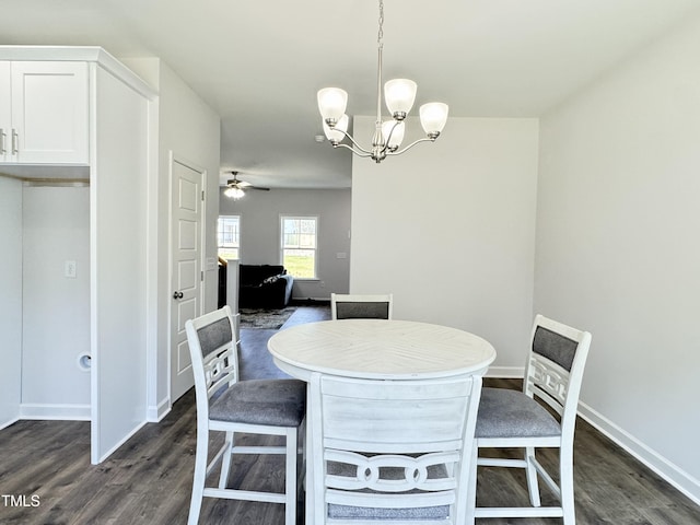 1387 Stoney Creek Church Rd, Goldsboro, NC 27534 - dining space with ceiling fan with notable chandelier, baseboards, and dark wood finished floors