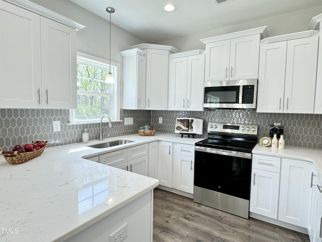 1387 Stoney Creek Church Rd, Goldsboro, NC 27534 - kitchen featuring a sink, white cabinetry, and appliances with stainless steel finishes