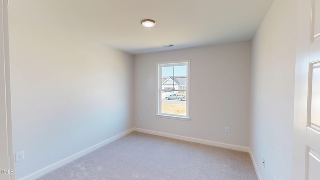 1387 Stoney Creek Church Rd, Goldsboro, NC 27534 - spare room with baseboards and light carpet
