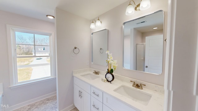 1387 Stoney Creek Church Rd, Goldsboro, NC 27534 - full bath with baseboards, double vanity, and an enclosed shower