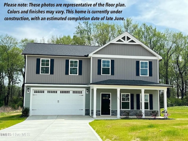 1387 Stoney Creek Church Rd, Goldsboro, NC 27534 - craftsman house featuring concrete driveway, a front yard, covered porch, and an attached garage