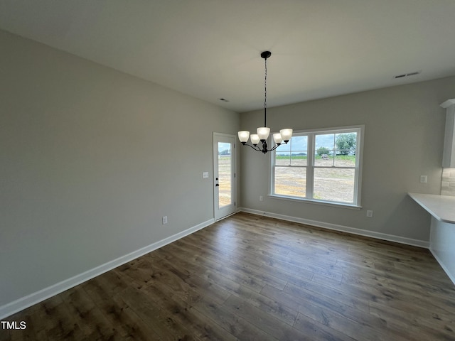 1387 Stoney Creek Church Rd, Goldsboro, NC 27534 - unfurnished dining area featuring a chandelier and dark wood-type flooring