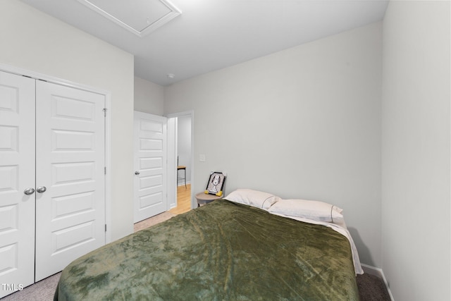 295 Springtooth Dr, Zebulon, NC 27597 - bedroom with a closet, light colored carpet, and baseboards