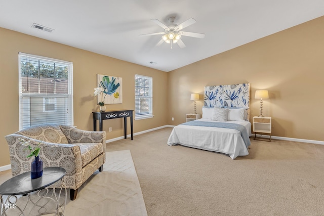 carpeted bedroom featuring visible vents, baseboards, a ceiling fan, and vaulted ceiling