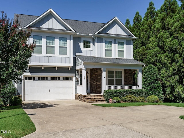 65 N Wilders Ridge Way, Clayton, NC 27527 - craftsman house with board and batten siding, covered porch, concrete driveway, and stone siding