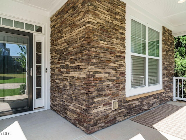 65 N Wilders Ridge Way, Clayton, NC 27527 - property entrance with covered porch and stone siding