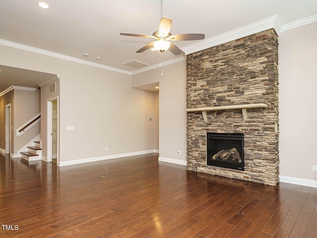 65 N Wilders Ridge Way, Clayton, NC 27527 - unfurnished living room with ceiling fan, stairway, wood finished floors, crown molding, and a stone fireplace