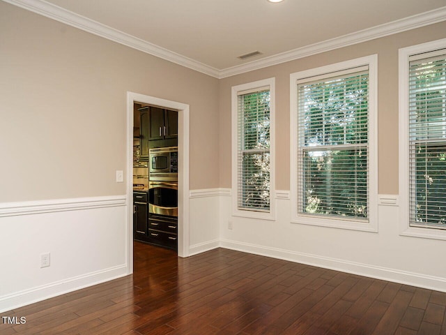 65 N Wilders Ridge Way, Clayton, NC 27527 - empty room with ornamental molding, wainscoting, and dark wood-style flooring