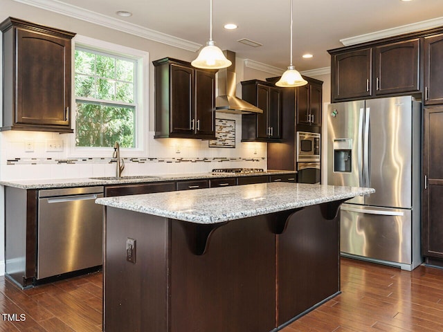 65 N Wilders Ridge Way, Clayton, NC 27527 - kitchen with stainless steel appliances, wall chimney range hood, dark brown cabinetry, dark wood-style floors, and ornamental molding