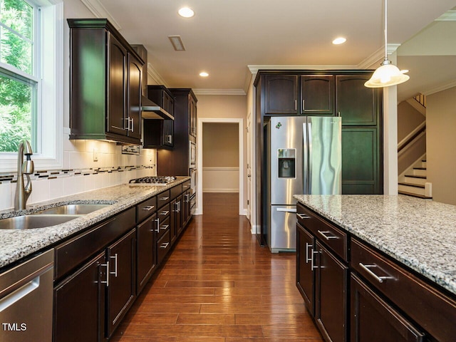 65 N Wilders Ridge Way, Clayton, NC 27527 - kitchen featuring stainless steel appliances, light stone countertops, crown molding, recessed lighting, and hanging light fixtures