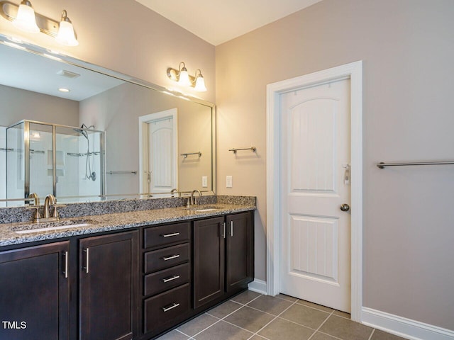 65 N Wilders Ridge Way, Clayton, NC 27527 - full bathroom with a stall shower, tile patterned flooring, and double vanity