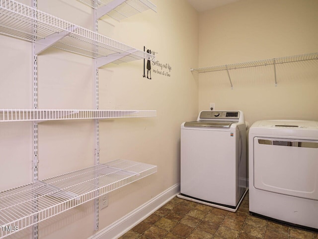 65 N Wilders Ridge Way, Clayton, NC 27527 - washroom with separate washer and dryer and stone finish floors