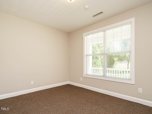 65 N Wilders Ridge Way, Clayton, NC 27527 - spare room with dark carpet and a smoke detector