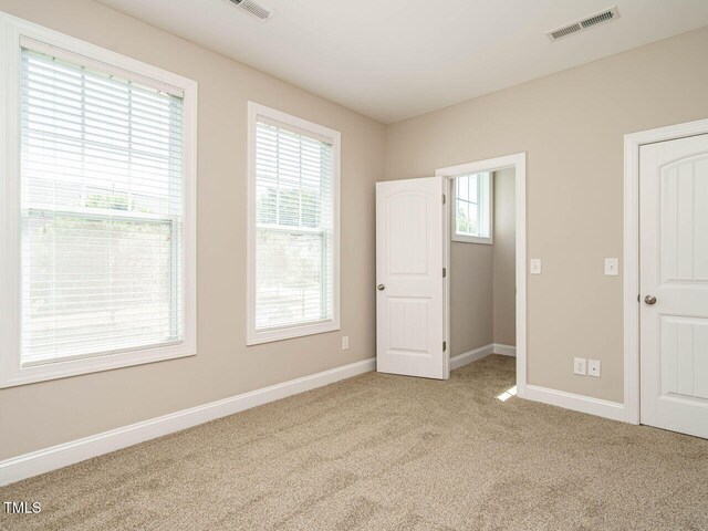 65 N Wilders Ridge Way, Clayton, NC 27527 - unfurnished bedroom featuring carpet and baseboards