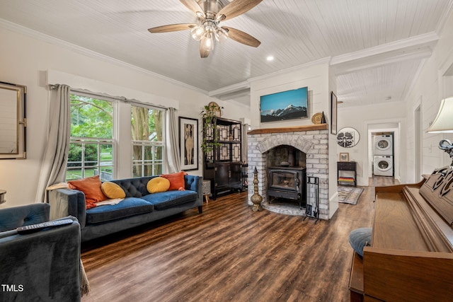 2815 Orange Grove Rd, Hillsborough, NC 27278 - living room featuring estacked washer and dryer, a wood stove, ornamental molding, wood finished floors, and ceiling fan