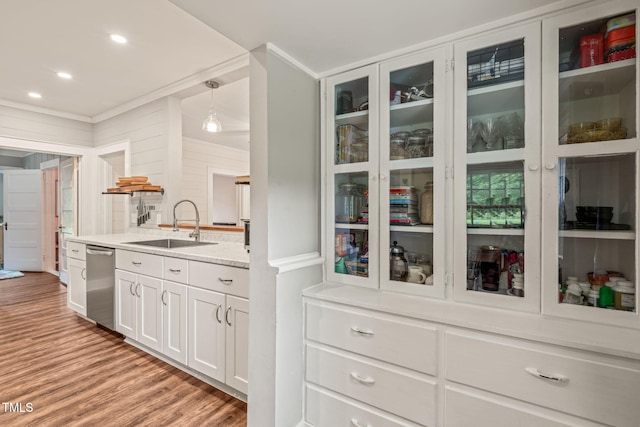 2815 Orange Grove Rd, Hillsborough, NC 27278 - kitchen with dishwasher, a sink, light wood finished floors, white cabinetry, and glass insert cabinets