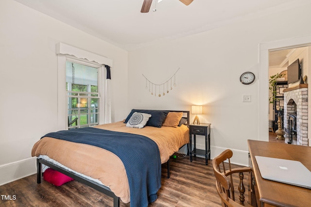 2815 Orange Grove Rd, Hillsborough, NC 27278 - bedroom with wood finished floors, baseboards, ceiling fan, and a fireplace
