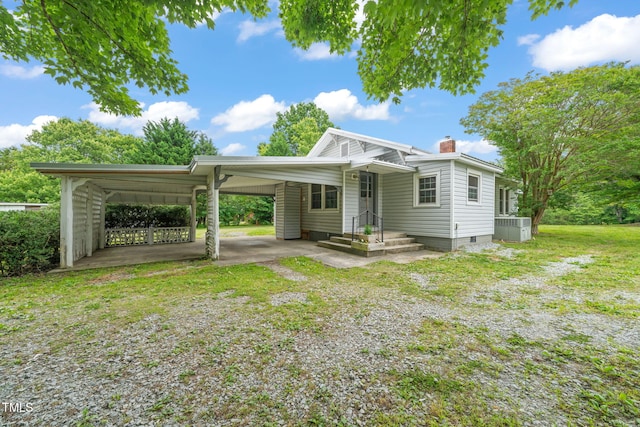 2815 Orange Grove Rd, Hillsborough, NC 27278 - view of front of home featuring a chimney, an attached carport, cooling unit, driveway, and crawl space