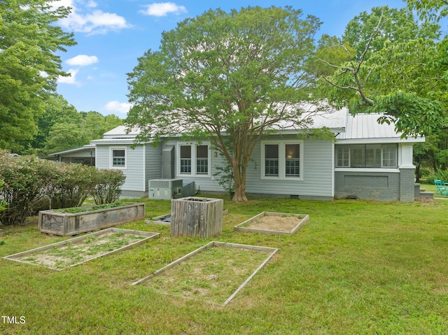 2815 Orange Grove Rd, Hillsborough, NC 27278 - rear view of house featuring a vegetable garden, a lawn, crawl space, and metal roof