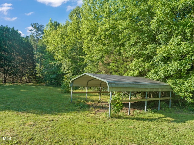 2815 Orange Grove Rd, Hillsborough, NC 27278 - view of grassy yard featuring a carport and a forest view
