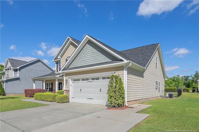 view of side of home featuring driveway, a lawn, a garage, and central air condition unit