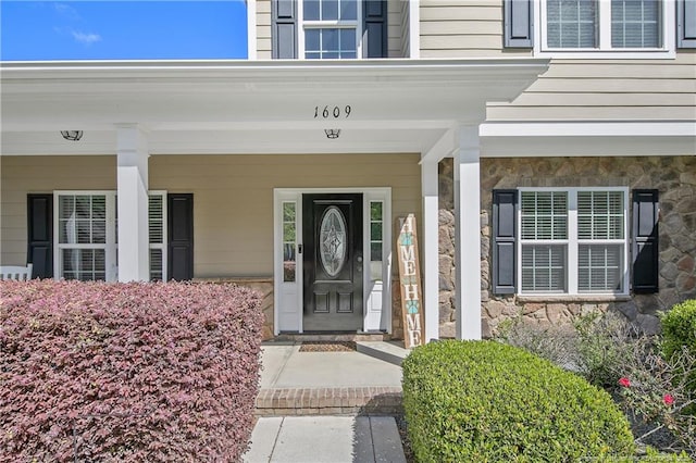 view of exterior entry with stone siding