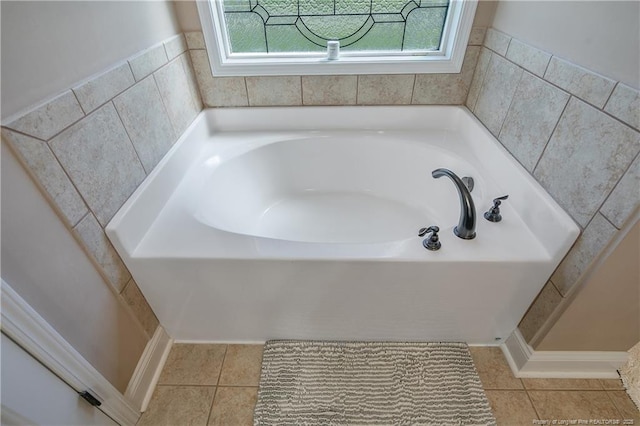 bathroom featuring a bath, tile patterned flooring, and plenty of natural light