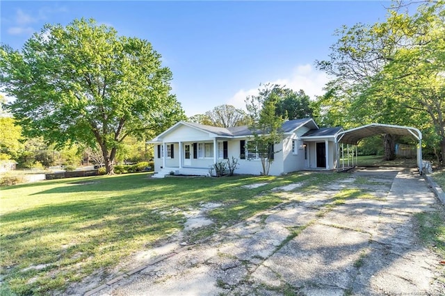 7517 Seaton Pl, Fayetteville, NC 28303 - view of front of property featuring a front yard, driveway, and a detached carport